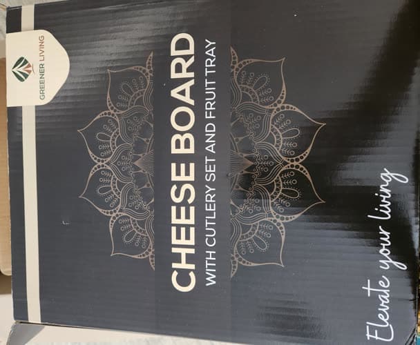 Customer photo of the board's black and gold gift box