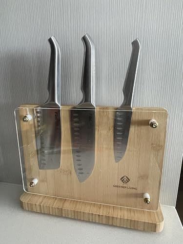 Customer photo of the magnetic knife holder holding three kitchen knives