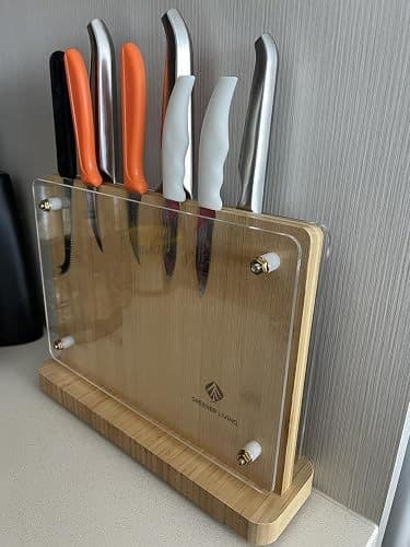 Customer photo of the magnetic knife holder holding six knives with different handle colours