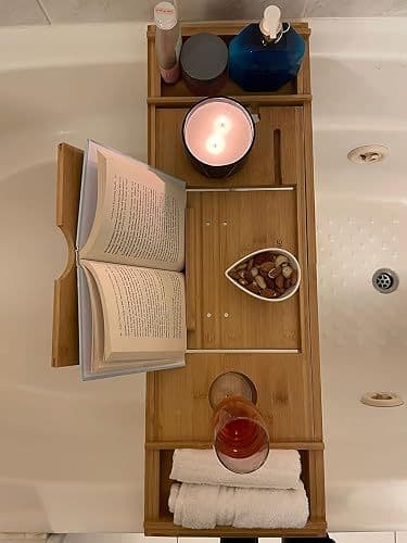 Customer overhead photo of the bath caddy in use with a book, candle and snacks