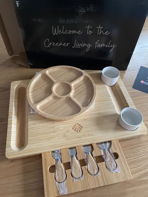 Customer photo of the unpacked set beside the Greener Living welcome card