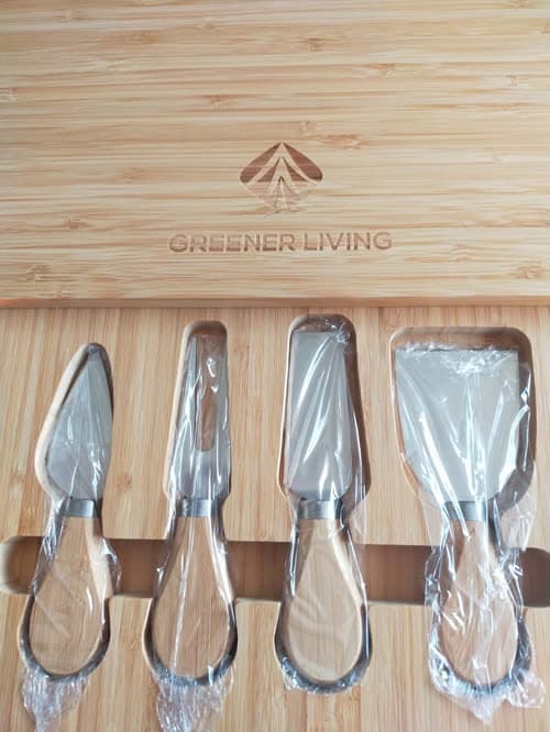 Customer photo of the four-piece knife set seated in the board below the engraved logo