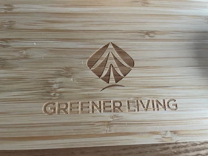 Customer close-up of the Greener Living logo engraved into the bamboo