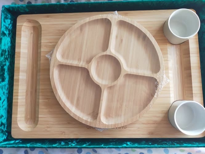 Customer photo of the board's fruit tray and ceramic bowls