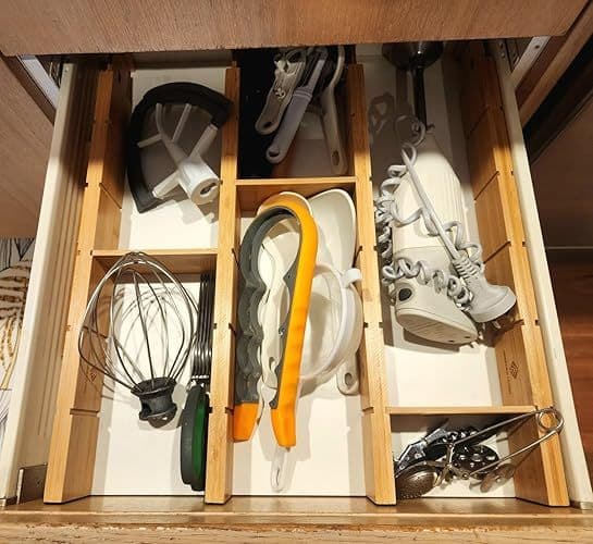 Customer photo of a drawer organised with kitchen gadgets and utensils using the dividers